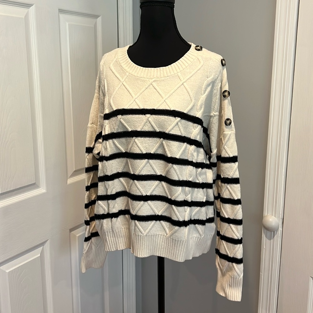Cream sweater with black stripes. XL.